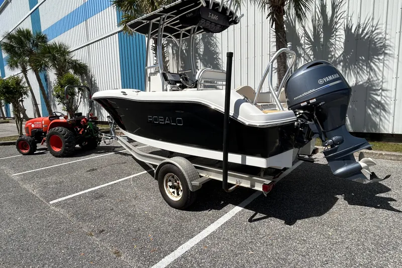Slide: The Image of 2018 Robalo R180 Center Console boat on trailer with Yamaha outboard motor. - 3