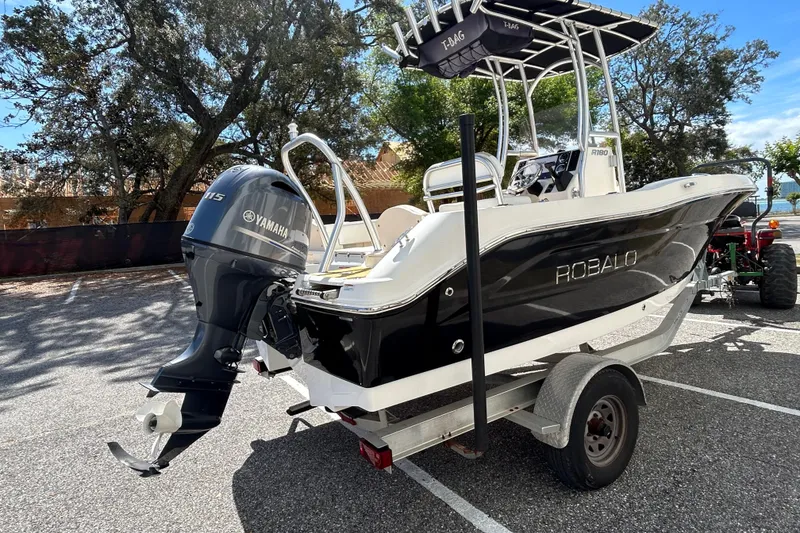 Slide: The Image of 2018 Robalo R180 Center Console boat with Yamaha engine on trailer. - 5