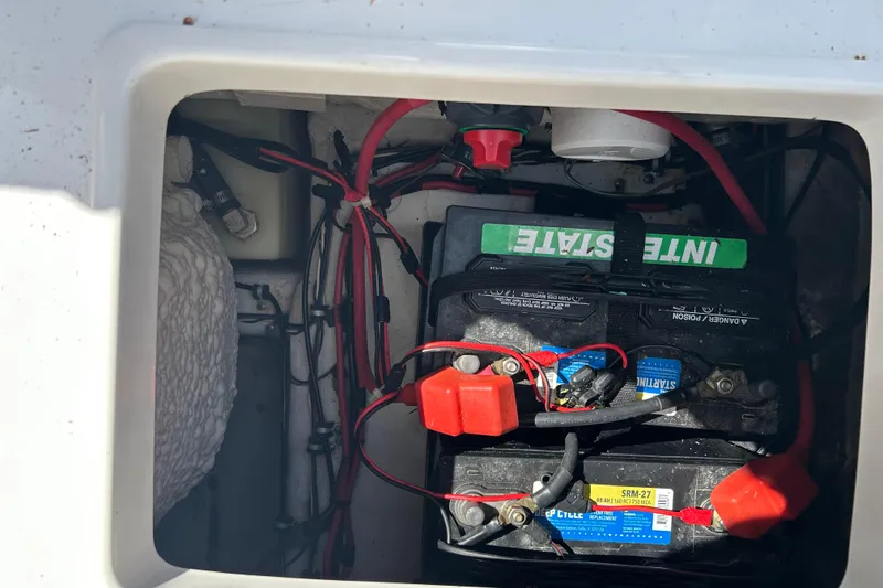 Slide: The Image of 2016 Sea Hunt Ultra 211 boat rear view with motor, displayed for sale. - 13