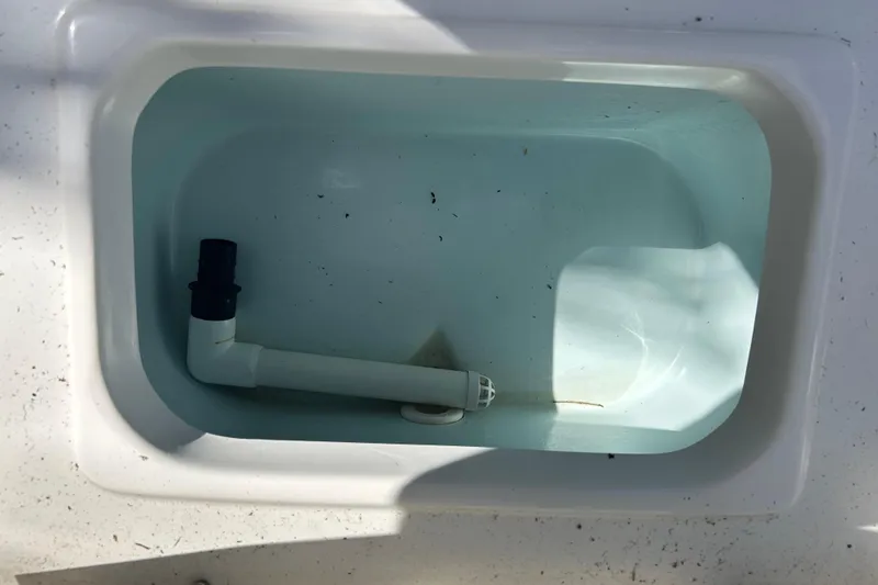 Slide: The Image of 2016 Sea Hunt Ultra 211 boat rear view with ladder and outboard motor. - 14