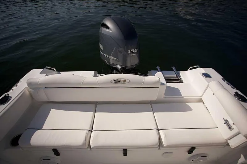 Slide: The Image of 2016 Sea Hunt Ultra 211 boat on trailer under clear blue sky. - 25