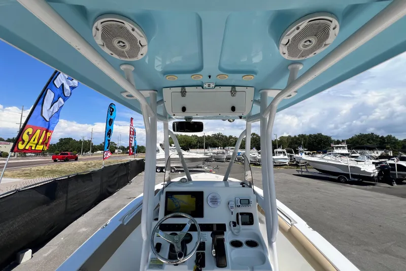 Slide: The Image of 2016 Sea Hunt Ultra 211 boat interior with steering wheel and control panel. - 35