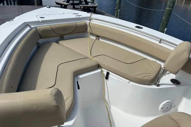 Slide: The Image of Chrome logo on a light blue 2016 Sea Hunt Ultra 211 boat. - 4