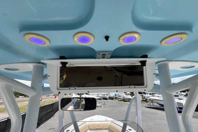 Slide: The Image of 2016 Sea Hunt Ultra 211 boat interior with blue ceiling and recessed lighting. - 46
