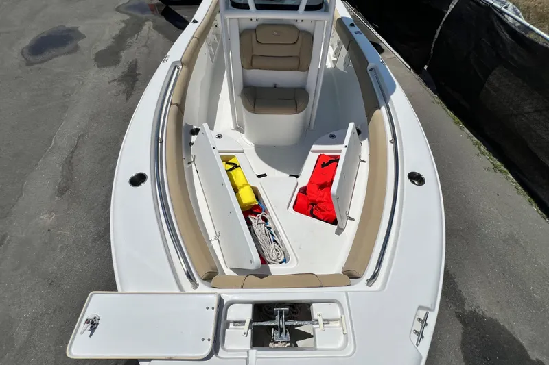 Slide: The Image of Overhead view of 2016 Sea Hunt Ultra 211 boat interior with storage compartments open. - 56