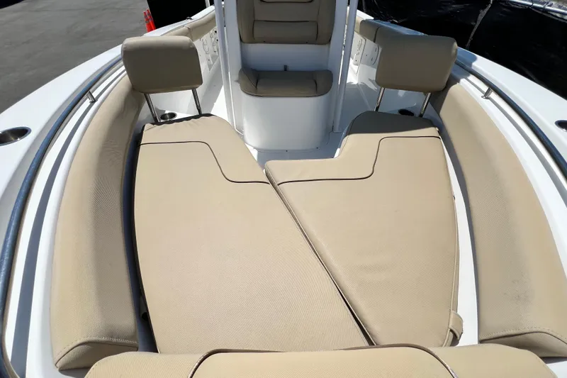 Slide: The Image of 2016 Sea Hunt Ultra 211 boat interior with beige cushioned seating. - 62