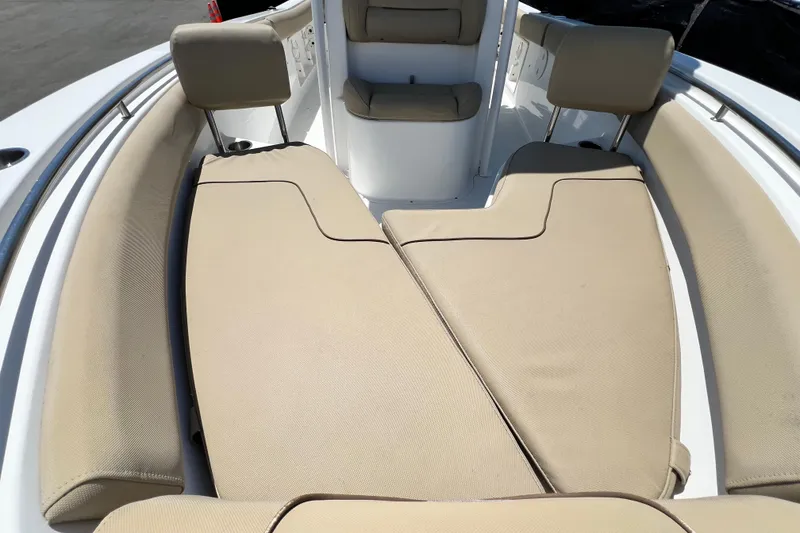 Slide: The Image of 2016 Sea Hunt Ultra 211 boat interior with beige cushioned seating. - 63