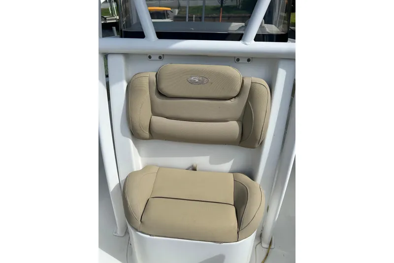 Slide: The Image of 2016 Sea Hunt Ultra 211 boat with 200 horsepower engine, parked outdoors. - 7