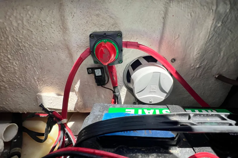 Slide: The Image of Electrical setup in a 2016 Sea Hunt Ultra 211 boat, featuring battery switch and wiring. - 73