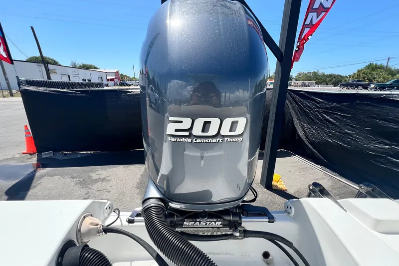 Slide: The Image of 2016 Sea Hunt Ultra 211 boat with 200 horsepower engine, featuring variable camshaft timing. - 78