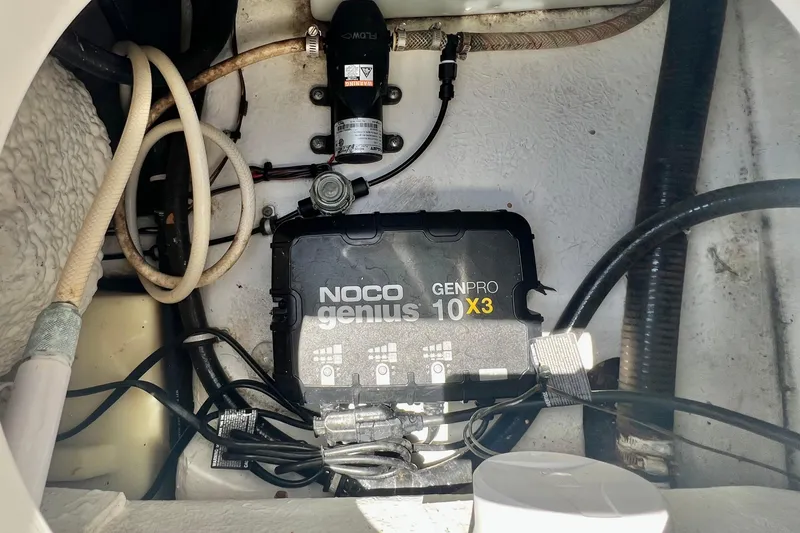 Slide: The Image of NOCO Genius GENPRO 10X3 charger inside 2016 Sea Hunt Ultra 211 boat compartment. - 79