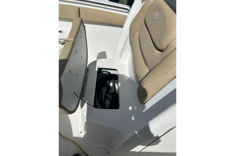 Slide: The Image of 2016 Sea Hunt Ultra 211 boat with 200 horsepower engine, displayed under clear blue sky. - 8