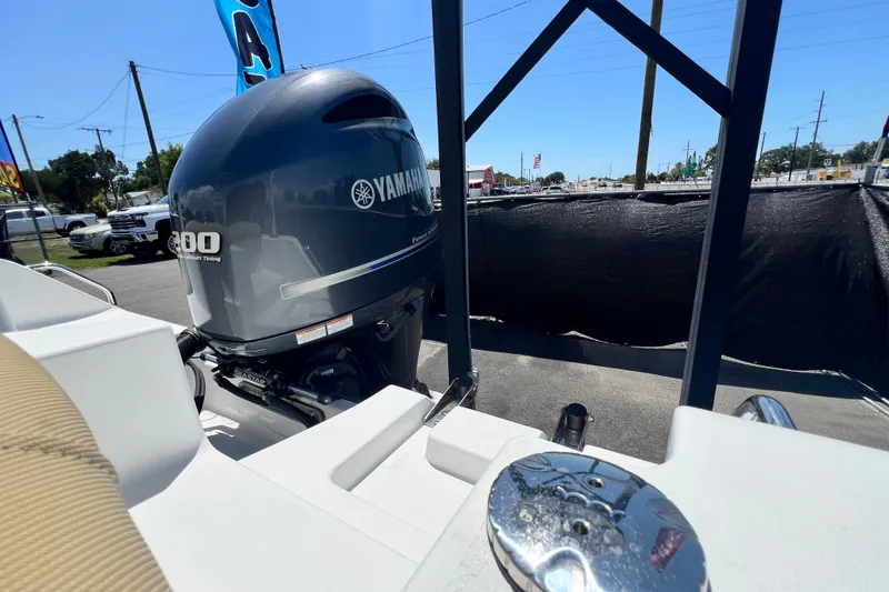 Slide: The Image of 2016 Sea Hunt Ultra 211 boat with Yamaha 200 engine, parked outdoors. - 82