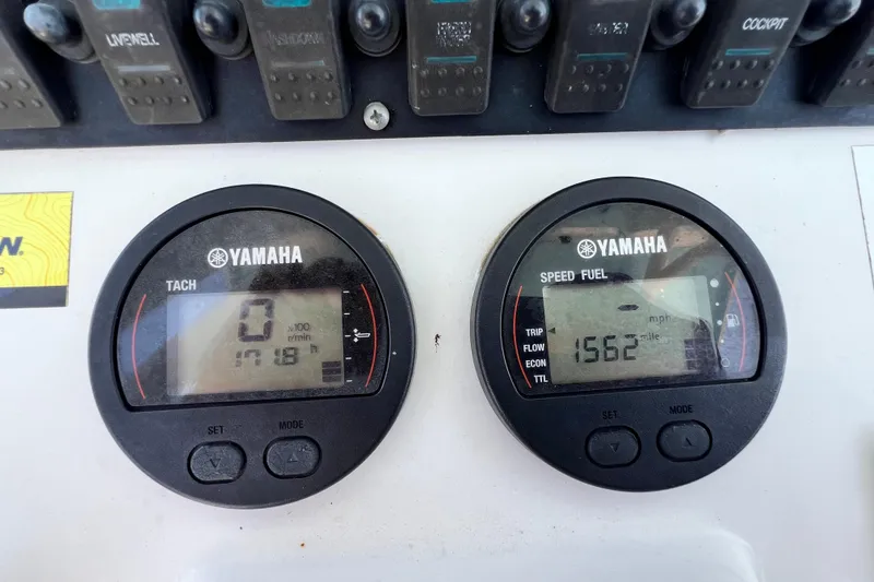 Slide: The Image of Yamaha gauges on 2016 Sea Hunt Ultra 211 boat dashboard, displaying tachometer and speed fuel readings. - 83