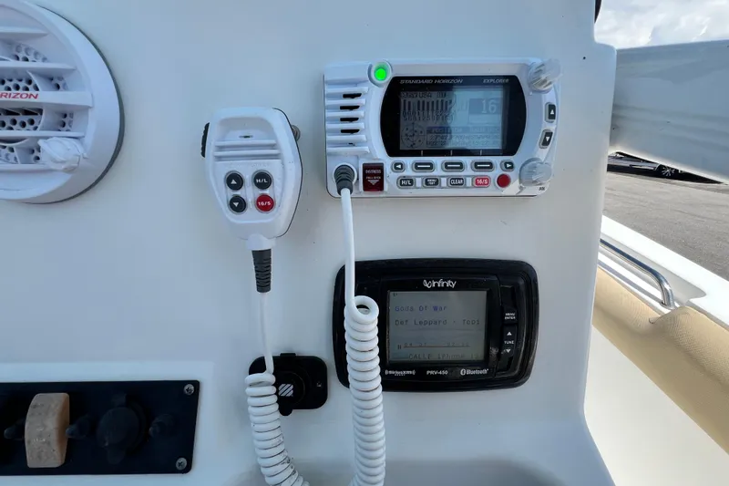Slide: The Image of Boat dashboard with radio and speaker on a 2016 Sea Hunt Ultra 211. - 85
