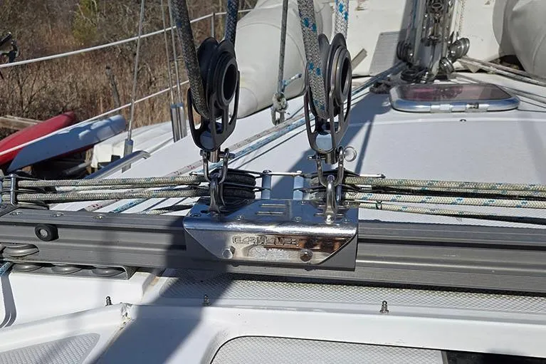 Slide: The Image of Deck of 2005 Catalina 310 sailboat with rigging and pulleys. - 10