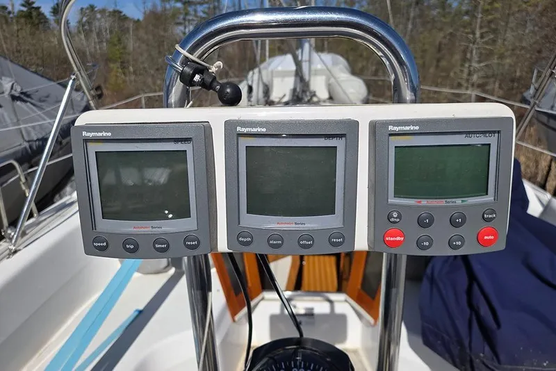 Slide: The Image of Raymarine navigation instruments on a 2005 Catalina 310 sailboat cockpit. - 18