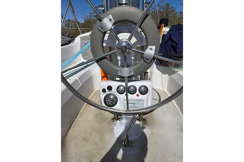Slide: The Image of Steering wheel and controls of a 2005 Catalina 310 sailboat cockpit. - 19