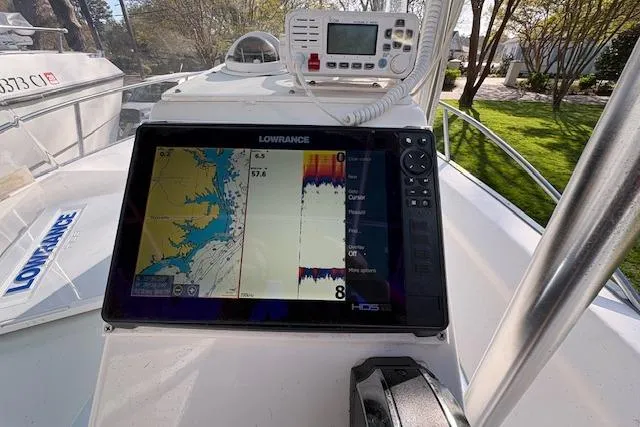 Slide: The Image of Lowrance navigation system on 2004 Palm Beach 205 cc boat, displaying map and sonar data. - 12
