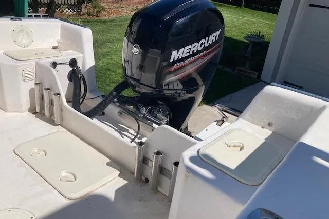 Slide: The Image of 2004 Palm Beach 205 cc boat stern with outboard motor and blue hull. - 5