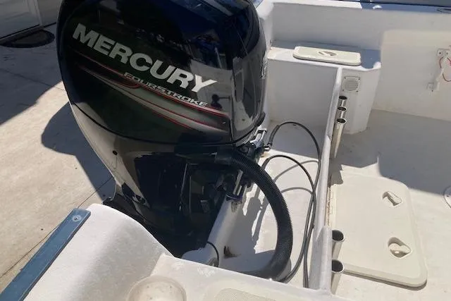 Slide: The Image of 2004 Palm Beach 205 cc boat on EZ Loader trailer in driveway. - 8