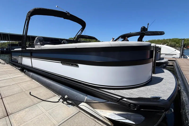 The Image of 2026 Viaggio D26U pontoon boat docked, featuring sleek design and modern amenities. - 1