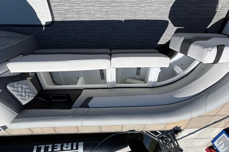 Slide: The Image of Interior view of 2026 Viaggio D26U boat with open storage compartments and cushioned seating. - 12