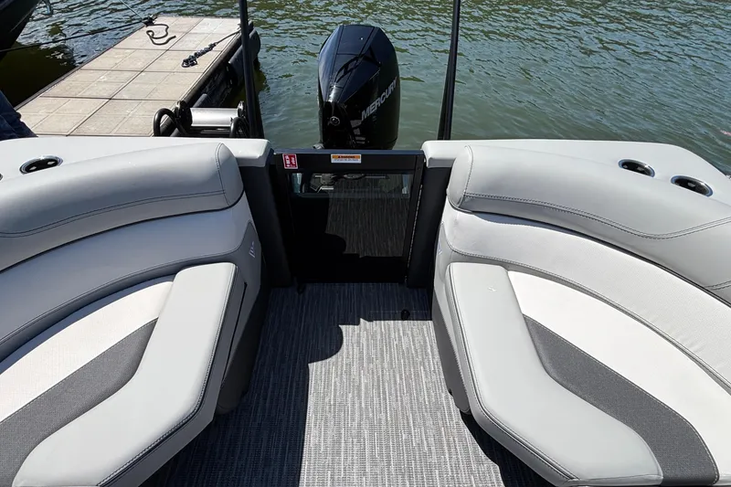 Slide: The Image of Interior view of 2026 Viaggio D26U boat with plush seating and water backdrop. - 25