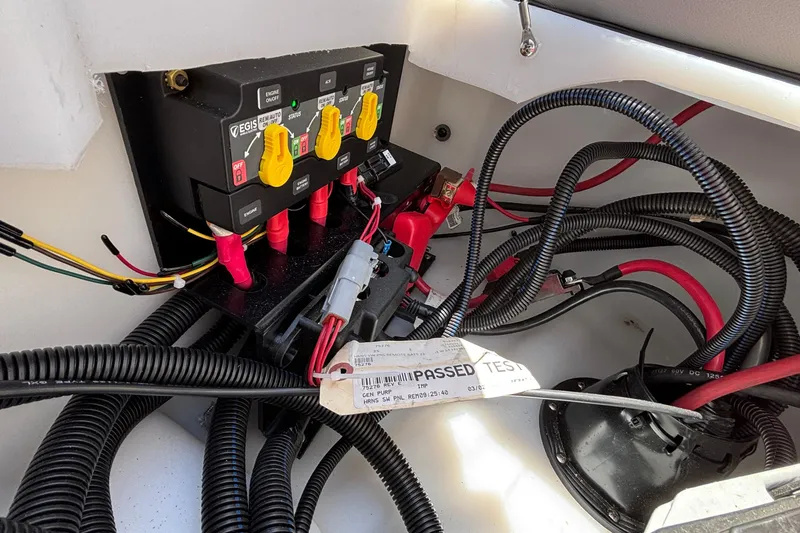 Slide: The Image of Electrical panel with wiring in a 2026 Viaggio D26U boat, featuring test certification. - 29