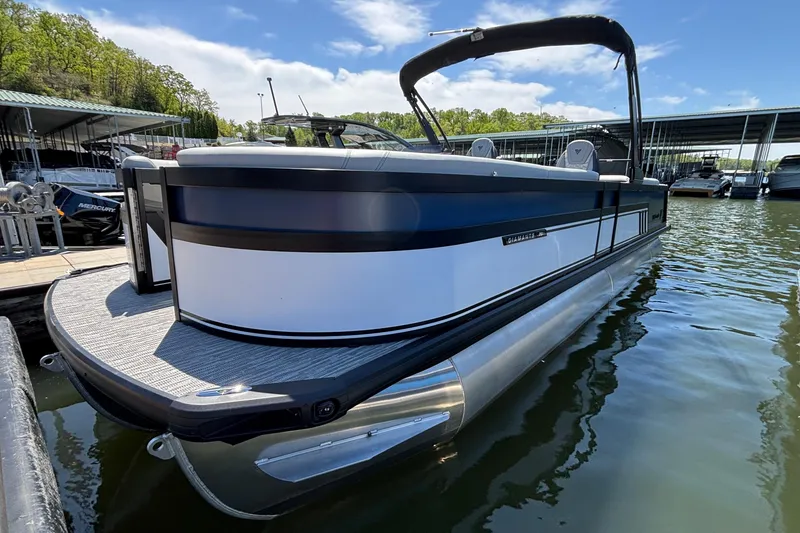 Slide: The Image of 2026 Viaggio D26U pontoon boat docked on a sunny day, showcasing sleek design and modern features. - 3