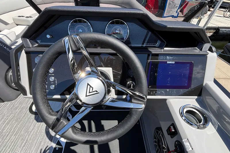 Slide: The Image of Steering wheel and dashboard of 2026 Viaggio D26U boat with modern controls. - 33