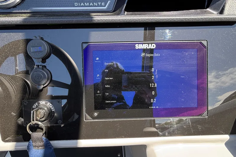 Slide: The Image of Dashboard of a 2026 Viaggio D26U boat with Simrad engine data display. - 35