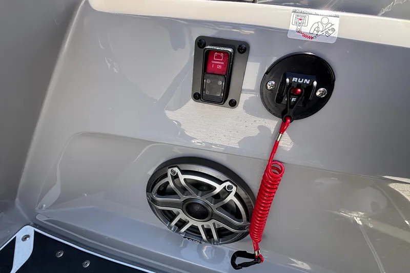 Slide: The Image of Control panel of a 2026 Viaggio D26U boat with safety switch and speaker. - 38