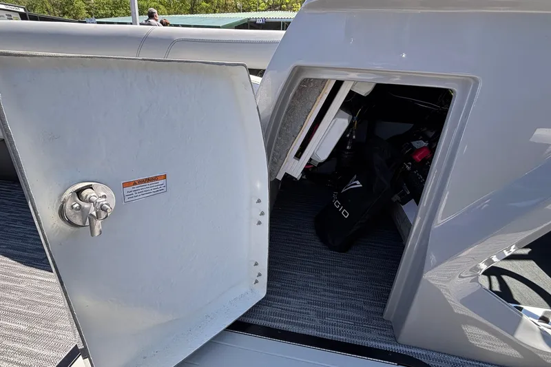 Slide: The Image of Open storage compartment on a 2026 Viaggio D26U boat, showing interior equipment. - 41