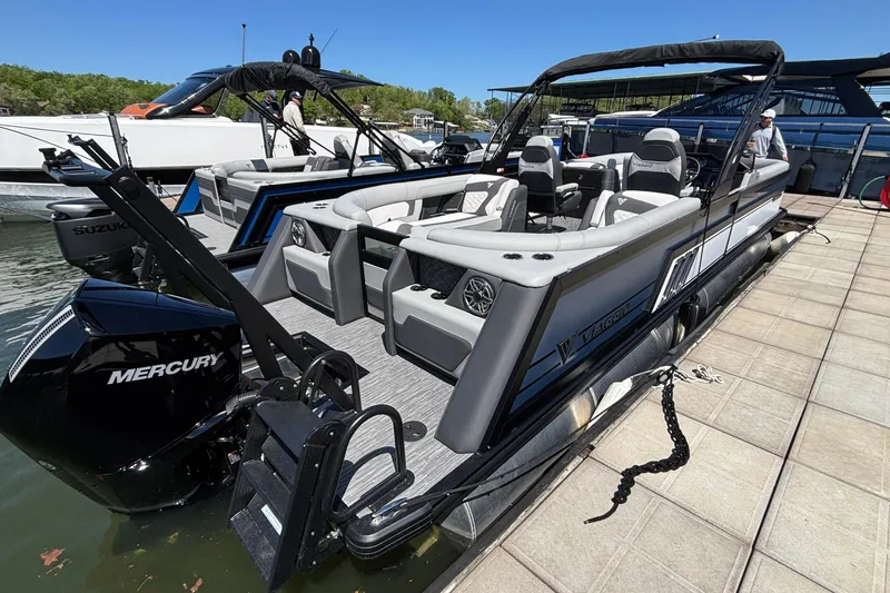 Slide: The Image of 2026 Viaggio D26U pontoon boat docked, featuring Mercury outboard motor and luxurious seating. - 44