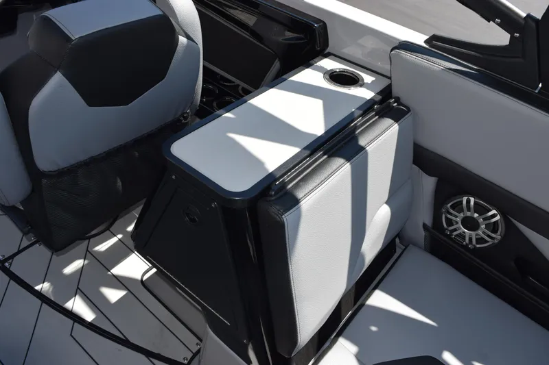 Slide: The Image of 2026 Yamaha Boats 255XD interior with sleek seating and integrated speaker system. - 12
