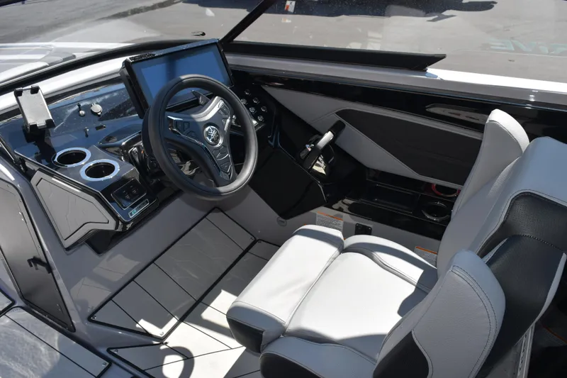 Slide: The Image of Interior of 2026 Yamaha Boats 255XD, featuring modern steering and control panel. - 14