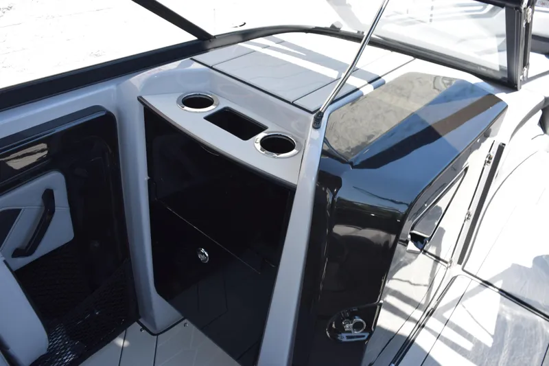 Slide: The Image of Interior view of 2026 Yamaha Boats 255XD, featuring sleek design and cup holders. - 17