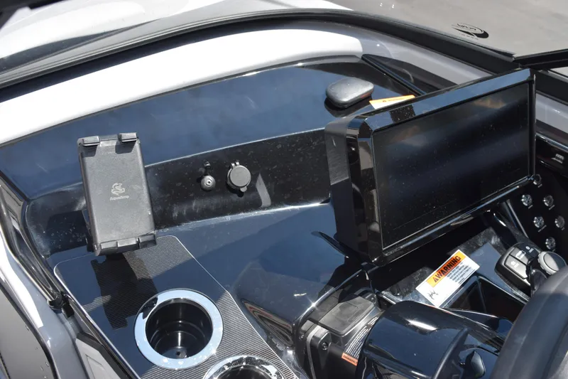 Slide: The Image of 2026 Yamaha Boats 255XD dashboard featuring modern controls and a sleek touchscreen display. - 18