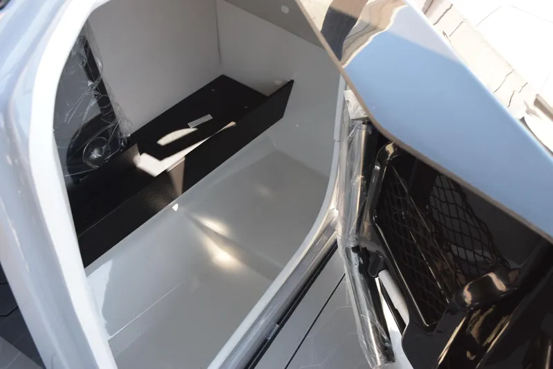 Slide: The Image of Interior storage compartment of 2026 Yamaha Boats 255XD, showcasing sleek design and spaciousness. - 22
