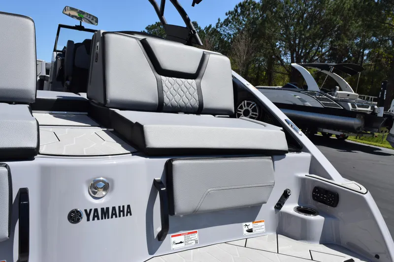 Slide: The Image of 2026 Yamaha Boats 255XD with sleek gray seating and modern design. - 8