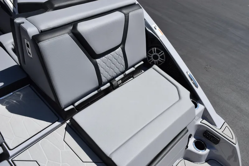 Slide: The Image of 2026 Yamaha Boats 255XD interior seating with sleek gray upholstery and modern design. - 9