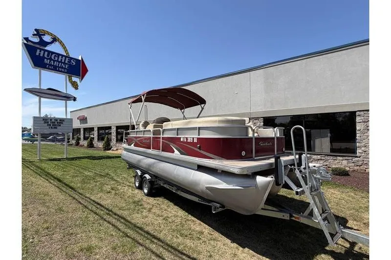 Slide: The Image of 2012 Sweetwater Premium Edition 220 DL pontoon boat on trailer at Hughes Marine. - 10