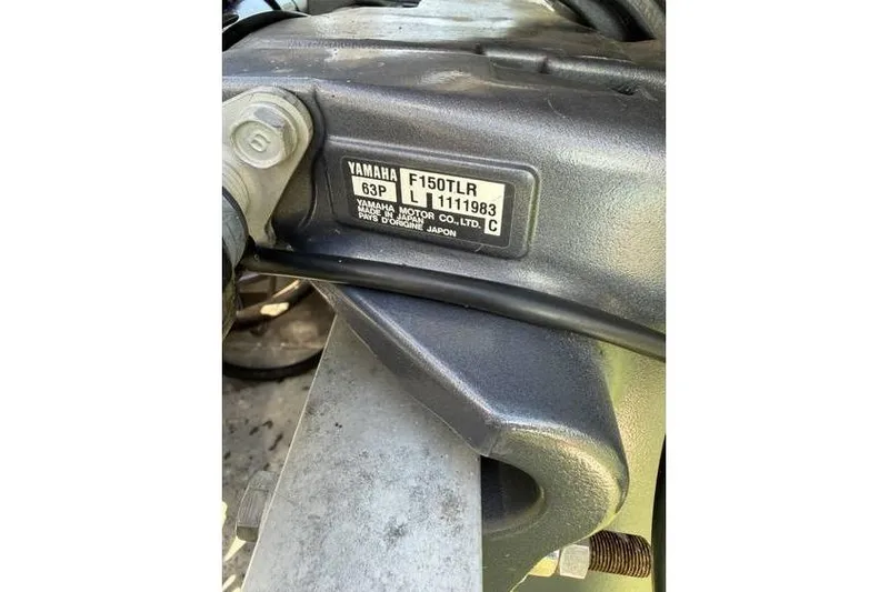 Slide: The Image of Close-up of Yamaha F150TLR engine label on Sweetwater Premium Edition 220 DL, 2012 model. - 18