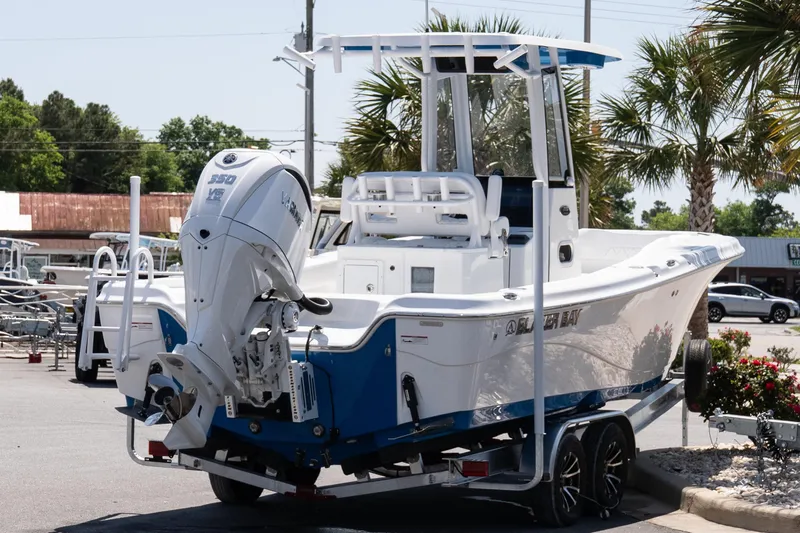Slide: The Image of 2026 Blazer Bay Makaira 2600 boat with powerful outboard motor, parked outdoors. - 6