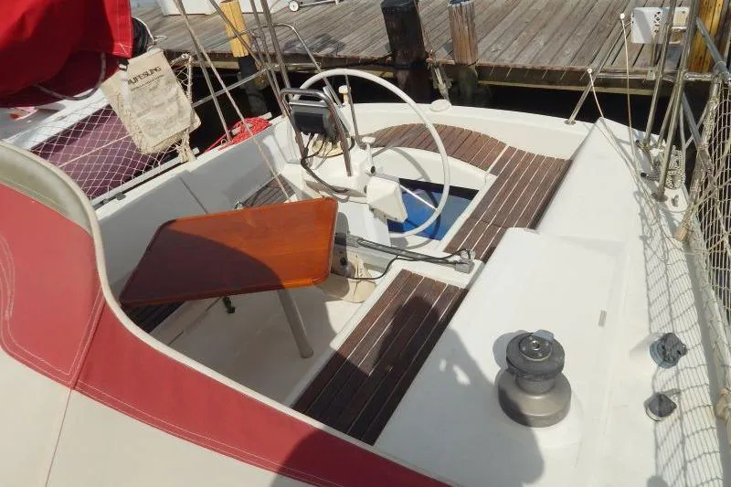 Slide: The Image of Cockpit of 1997 Etap 38i sailboat with wooden table and steering wheel. - 12