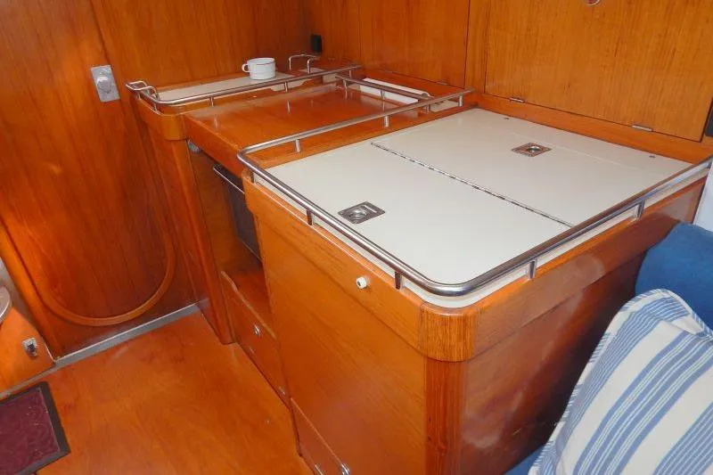 Slide: The Image of Wooden interior of 1997 Etap 38i yacht galley with countertop and storage. - 18