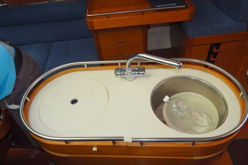 Slide: The Image of Interior of a 1997 Etap 38i yacht featuring a compact kitchen sink area. - 20