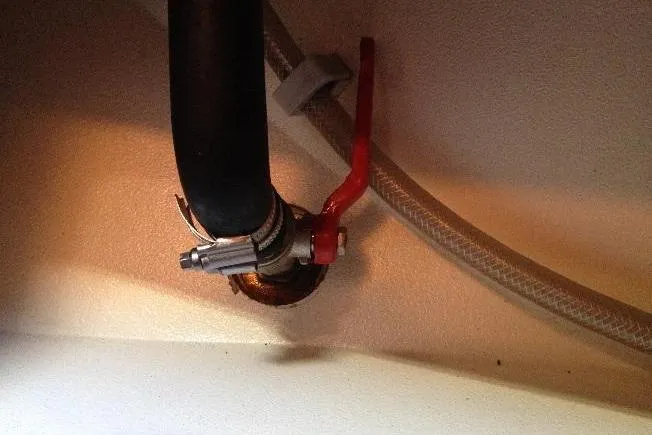 Slide: The Image of Close-up of plumbing with red valve on 1997 Etap 38i boat. - 40