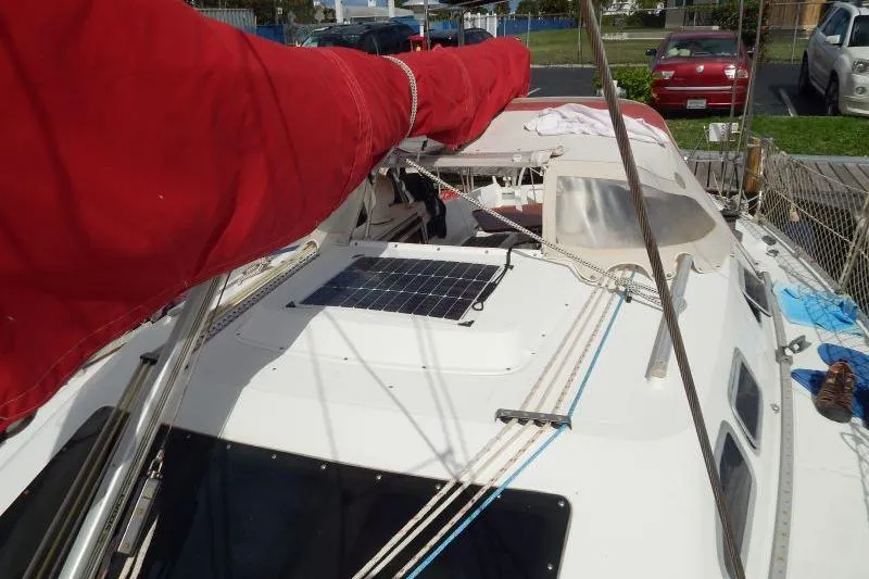 Slide: The Image of 1997 Etap 38i sailboat deck with solar panel and red sail cover. - 5